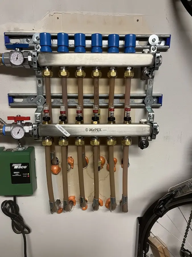 Plumber performing Water Heater Repair at a residential property in Saluda